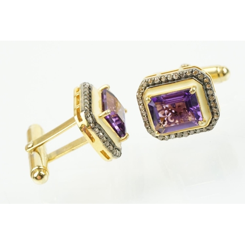 273 - Pair of silver amethyst and diamond set cufflinks being set with emerald cut amethysts to centre sur... 