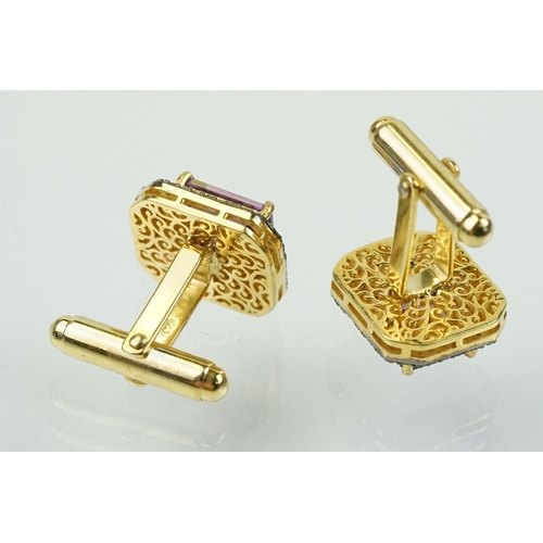 273 - Pair of silver amethyst and diamond set cufflinks being set with emerald cut amethysts to centre sur... 