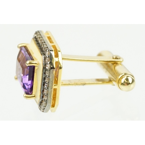 273 - Pair of silver amethyst and diamond set cufflinks being set with emerald cut amethysts to centre sur... 