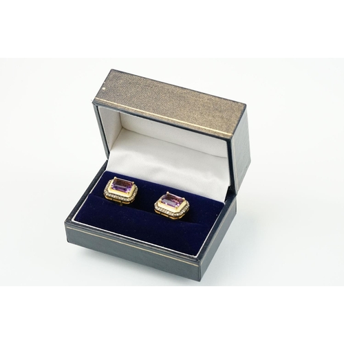 273 - Pair of silver amethyst and diamond set cufflinks being set with emerald cut amethysts to centre sur... 