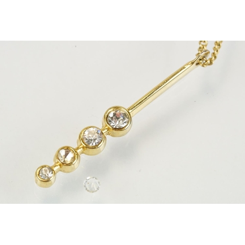 276 - 18ct gold and diamond pendant necklace having an oval pendant set with white accent stones to a fine... 