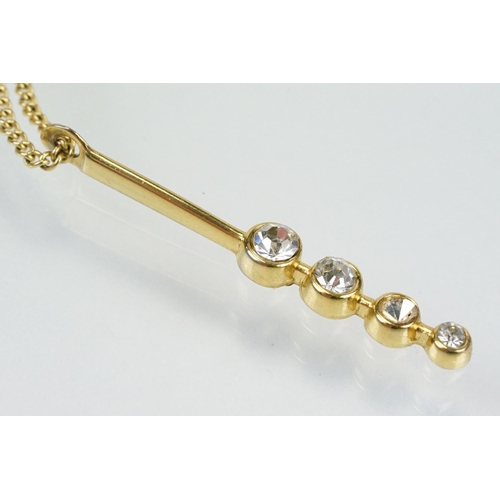 276 - 18ct gold and diamond pendant necklace having an oval pendant set with white accent stones to a fine... 