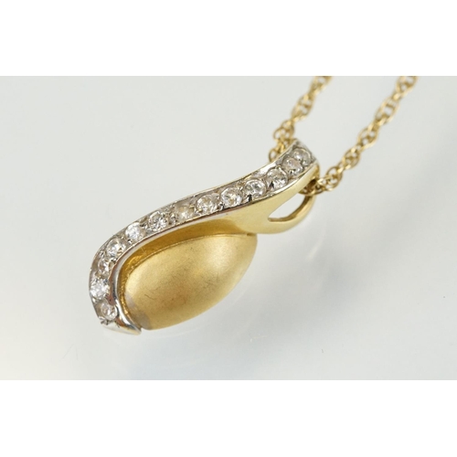 276 - 18ct gold and diamond pendant necklace having an oval pendant set with white accent stones to a fine... 