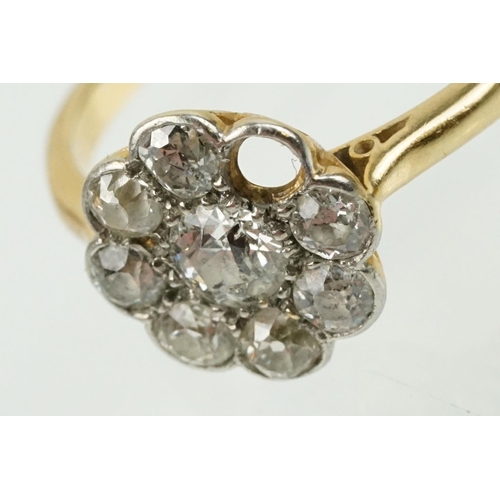 277 - Early 20th Century 18ct gold and diamond daisy cluster ring. The ring being set with eight old cut d... 