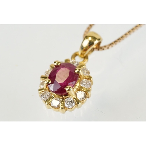 279 - 18ct gold pendant set with an oval cut ruby to centre with a halo of round cut diamonds. Pendant wit... 