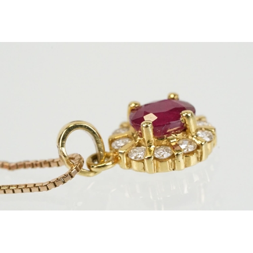 279 - 18ct gold pendant set with an oval cut ruby to centre with a halo of round cut diamonds. Pendant wit... 