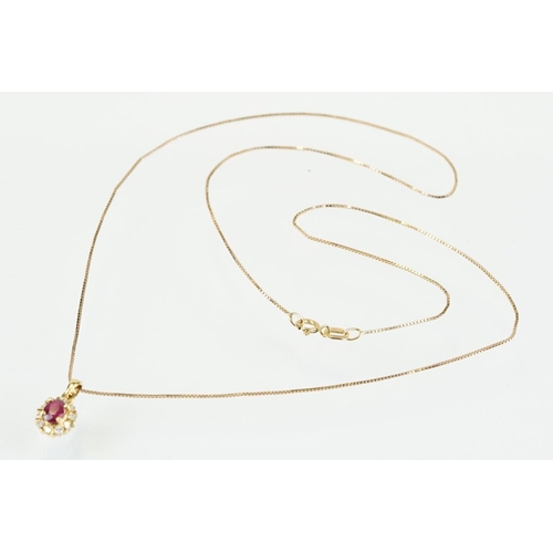 279 - 18ct gold pendant set with an oval cut ruby to centre with a halo of round cut diamonds. Pendant wit... 