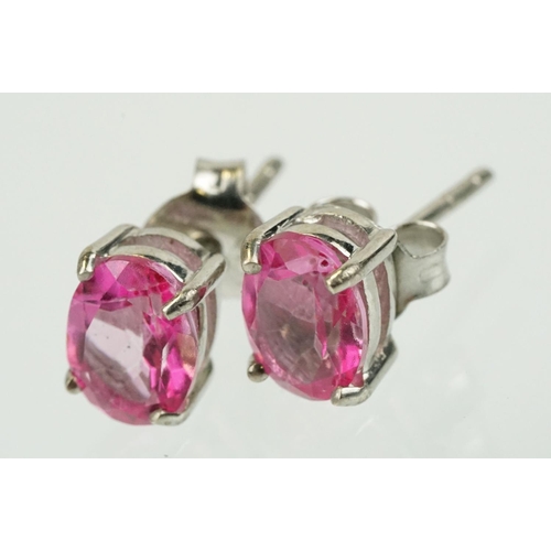 291 - Pair of silver and pink topaz stud earrings being set with oval cut topaz. Marked 925. Measures 8mm.