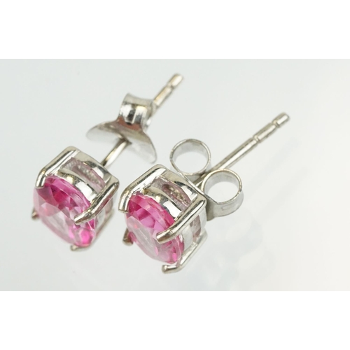 291 - Pair of silver and pink topaz stud earrings being set with oval cut topaz. Marked 925. Measures 8mm.