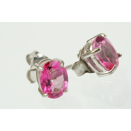 291 - Pair of silver and pink topaz stud earrings being set with oval cut topaz. Marked 925. Measures 8mm.