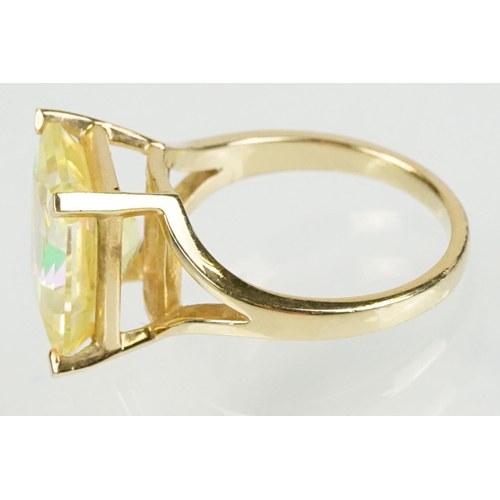 294 - 14ct gold and yellow stone dress ring set with a large yellow gem stone. Marked 14k to the band. Siz... 