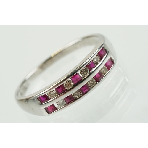 295 - 14ct white gold diamond and ruby double line ring being channel set with eight round brilliant cut r... 