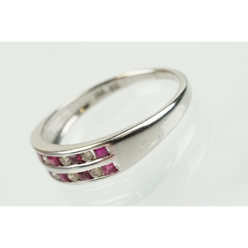 295 - 14ct white gold diamond and ruby double line ring being channel set with eight round brilliant cut r... 