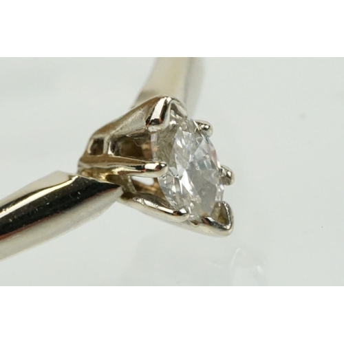 297 - 14ct white gold and diamond solitaire ring being set with a marquise cut diamond. Marked 14k to shan... 