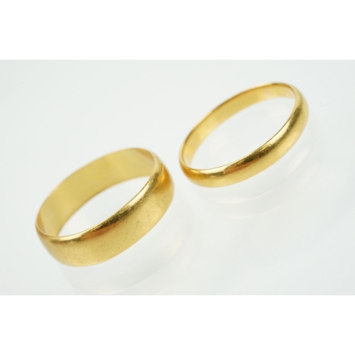 302 - Two hallmarked 22ct gold wedding band ring to include one of wide 'D' form (hallmarked Birmingham 19... 