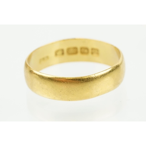 302 - Two hallmarked 22ct gold wedding band ring to include one of wide 'D' form (hallmarked Birmingham 19... 