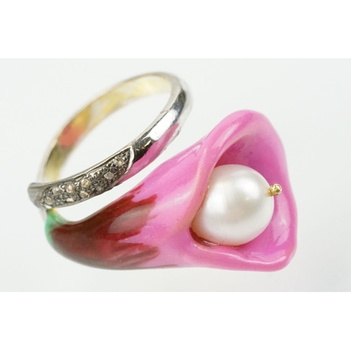 306 - Enamelled flower formed ring being set with a cultured pearl to the head with diamond accent stones ... 