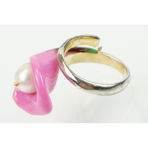 306 - Enamelled flower formed ring being set with a cultured pearl to the head with diamond accent stones ... 