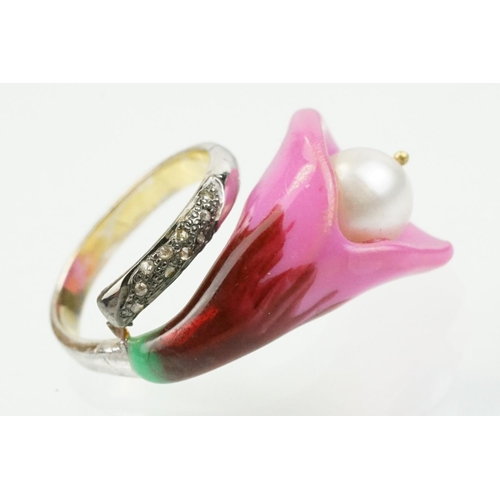 306 - Enamelled flower formed ring being set with a cultured pearl to the head with diamond accent stones ... 