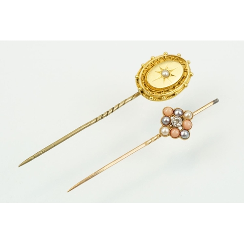 324 - Two 19th Century stick pins to include a diamond, coral and half pearl finial pin (unmarked) and an ... 