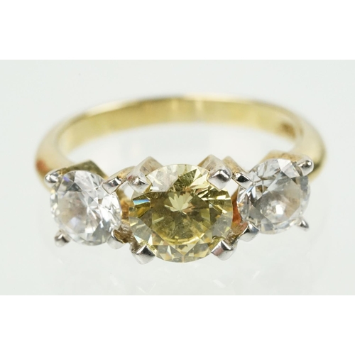 327 - Three stone dress ring being set with a yellow stone to centre flanked by two white stones in a yell... 