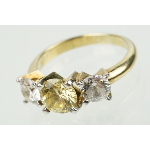 327 - Three stone dress ring being set with a yellow stone to centre flanked by two white stones in a yell... 