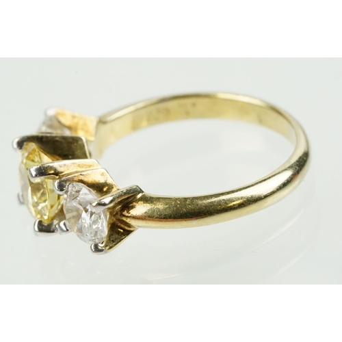 327 - Three stone dress ring being set with a yellow stone to centre flanked by two white stones in a yell... 