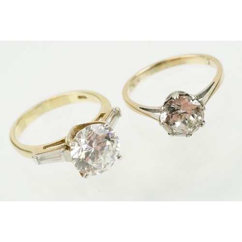 329 - Two white stone dress rings to include a solitaire ring having a round cut white stone in a basket s... 