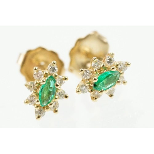 333 - Pair of 14ct gold, emerald and diamond cluster earrings. The each set with a central marquise cut em... 