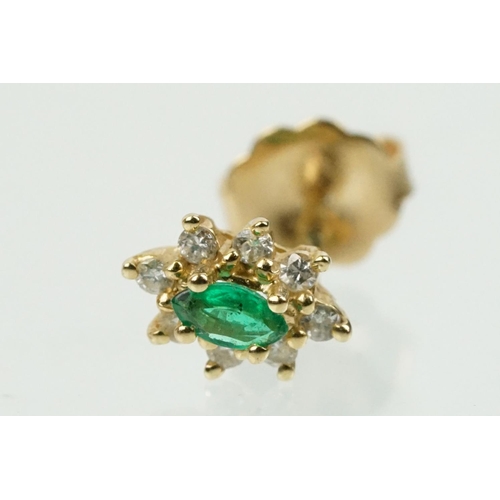 333 - Pair of 14ct gold, emerald and diamond cluster earrings. The each set with a central marquise cut em... 