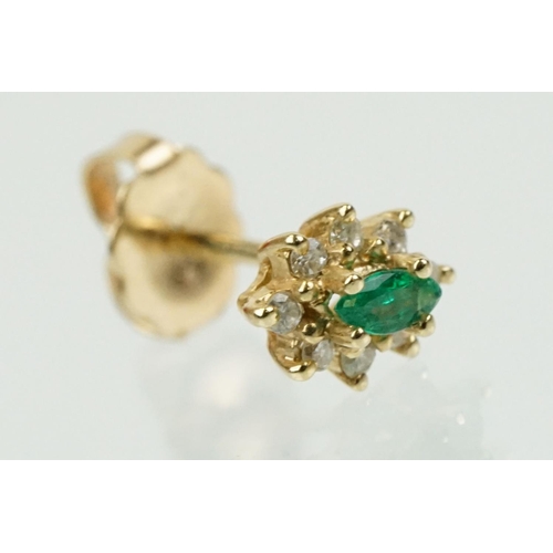 333 - Pair of 14ct gold, emerald and diamond cluster earrings. The each set with a central marquise cut em... 