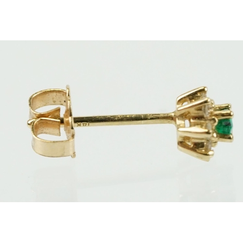 333 - Pair of 14ct gold, emerald and diamond cluster earrings. The each set with a central marquise cut em... 