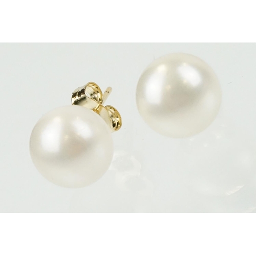 334 - Pair of 9ct gold and cultured pearl stud earrings having spherical pearls with post and butterfly fi... 