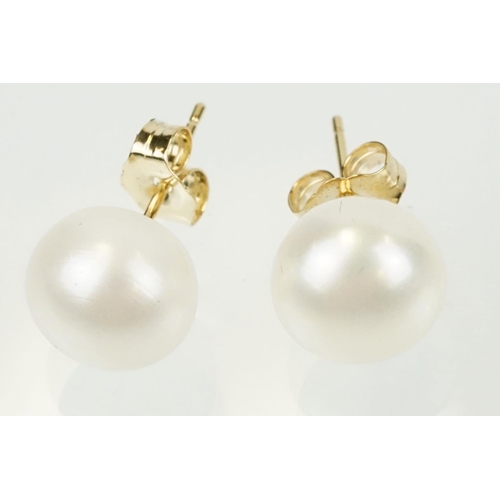 334 - Pair of 9ct gold and cultured pearl stud earrings having spherical pearls with post and butterfly fi... 