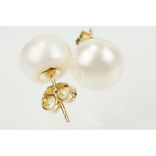 334 - Pair of 9ct gold and cultured pearl stud earrings having spherical pearls with post and butterfly fi... 