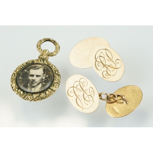 336 - 19th Century gold plated photo locket of round form being floral engraved and with an engine turned ... 