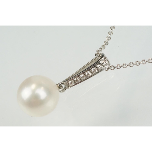 342 - Cultured pearl and diamond pendant having a single spherical pearl with diamond accent stones to the... 