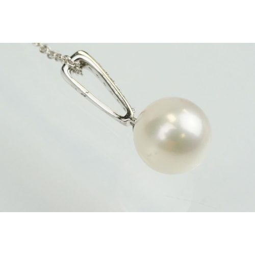 342 - Cultured pearl and diamond pendant having a single spherical pearl with diamond accent stones to the... 