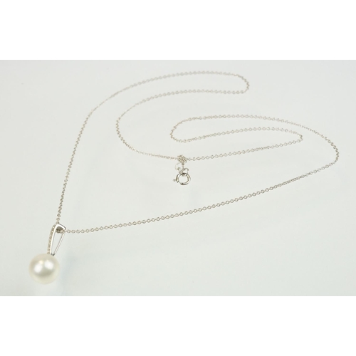 342 - Cultured pearl and diamond pendant having a single spherical pearl with diamond accent stones to the... 