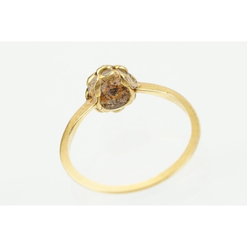 343 - Three antique rings to include an 18ct gold daisy ring (marked 18ct, size M.5), 9ct gold signet ring... 