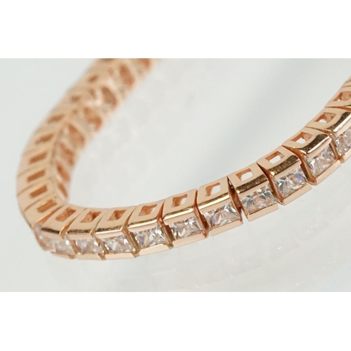 344 - Silver rose gold pated and cubic zirconia line bracelet being set throughout with square cut CS's. C... 