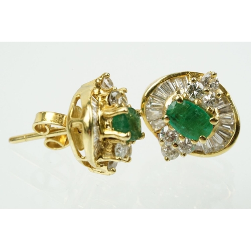 345 - Pair of 18ct gold emerald and diamond cluster earrings each being set with a central oval cut emeral... 