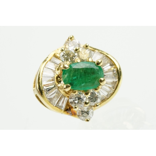 345 - Pair of 18ct gold emerald and diamond cluster earrings each being set with a central oval cut emeral... 