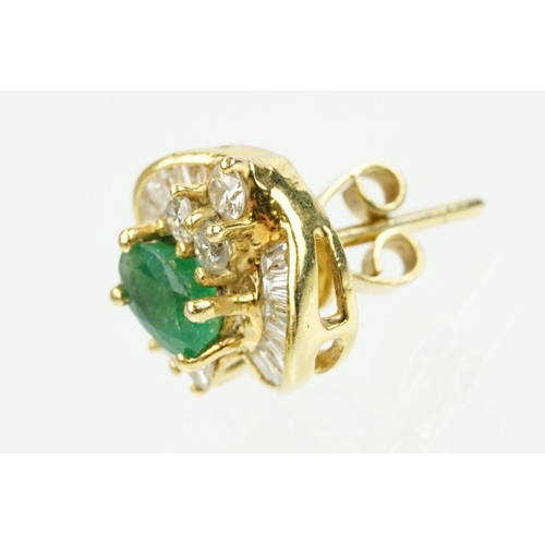 345 - Pair of 18ct gold emerald and diamond cluster earrings each being set with a central oval cut emeral... 