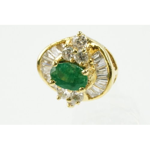 345 - Pair of 18ct gold emerald and diamond cluster earrings each being set with a central oval cut emeral... 