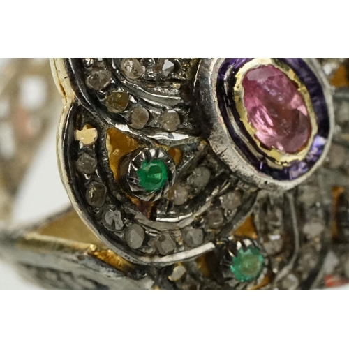 346 - Silver gilt dress ring having a flower shaped panel set with a pink tourmaline to centre, surrounded... 