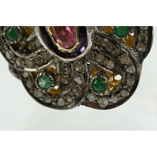 346 - Silver gilt dress ring having a flower shaped panel set with a pink tourmaline to centre, surrounded... 