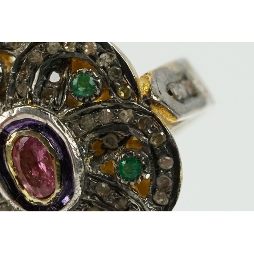 346 - Silver gilt dress ring having a flower shaped panel set with a pink tourmaline to centre, surrounded... 