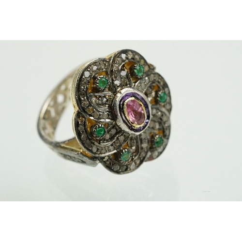 346 - Silver gilt dress ring having a flower shaped panel set with a pink tourmaline to centre, surrounded... 