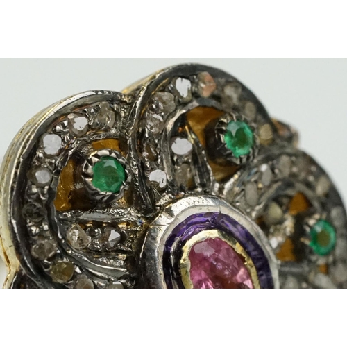 346 - Silver gilt dress ring having a flower shaped panel set with a pink tourmaline to centre, surrounded... 